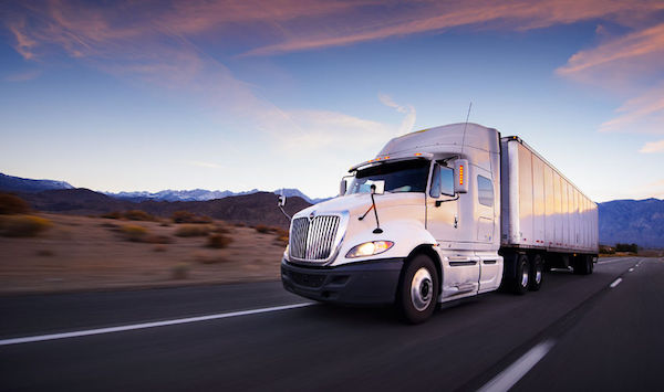 26129984 - truck and highway at sunset - transportation background