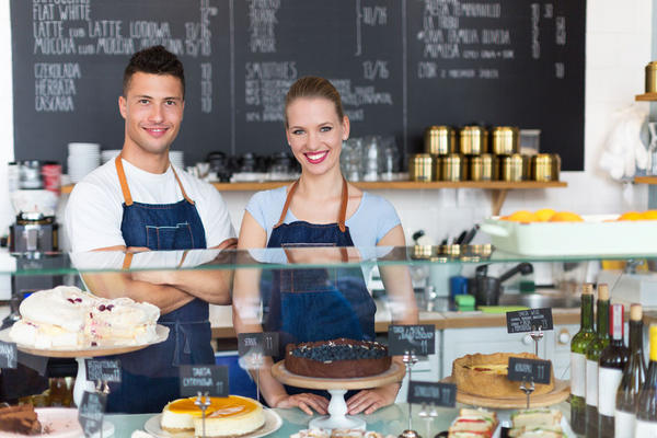 47219690 - man and woman working in a coffee shop